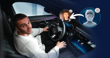 
						  Produktmanager Christopher Hartung sitzt hinter dem Steuer eines Mercedes-Benz und blickt in die Kamera.
						  